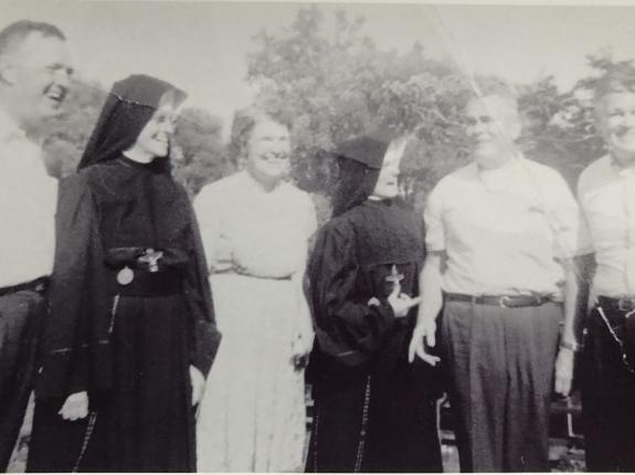 Sr. Mary Josepha on the left, her niece Sr. Anne Kniphuisen on the right of Sr. Anne's mom, Anne O'Reilly Kniphuisen. They are surrounded by the O'Reilly men!