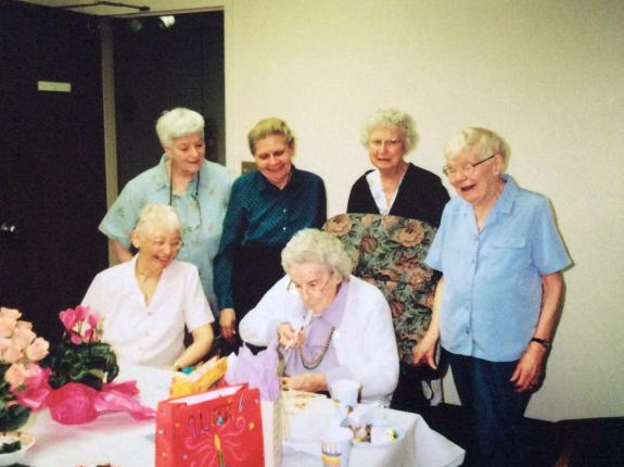 Sr. Martina (seated in center) celebrates her birthday with many RDC friends.