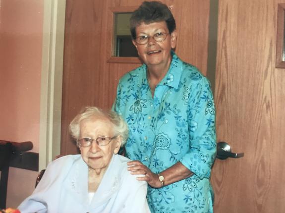 Sr. M. Gonzaga is seated; Sr. Pat Smith supports her friend.